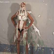 Anglefan: Hot busty blonde Natalie gets pied in a black thong!