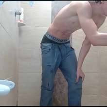 WETColours: Dario in His First Shower with T-shirt and Jeans