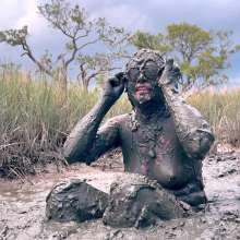 Messy Temptress: Muddy Fun in Converse and Fishnets