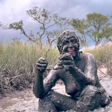 Messy Temptress: Muddy Fun in Converse and Fishnets