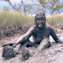 Messy Temptress: Muddy Fun in Converse and Fishnets