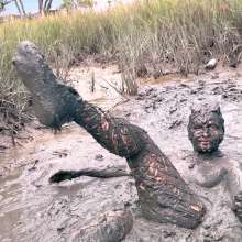 Messy Temptress: Muddy Fun in Converse and Fishnets