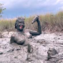 Messy Temptress: Muddy Fun in Converse and Fishnets