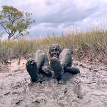 Messy Temptress: Muddy Fun in Converse and Fishnets
