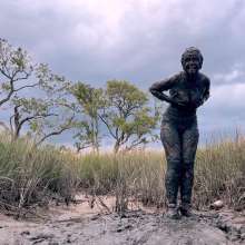Messy Temptress: Muddy Fun in Converse and Fishnets