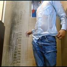 WETColours: Nixon in the Shower in a Light Blue Shirt and Jeans