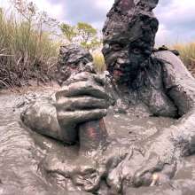Messy Temptress: Sloppy Handjob in the Mud