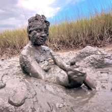 Messy Temptress: Sloppy Handjob in the Mud