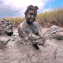 Messy Temptress: Sloppy Handjob in the Mud