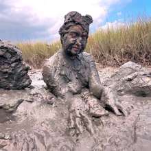 Messy Temptress: Sloppy Handjob in the Mud