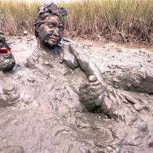 Messy Temptress: Sloppy Handjob in the Mud