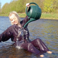 DungeonMasterOne: Modesty takes to the river in a classic dark blue boilersuit
