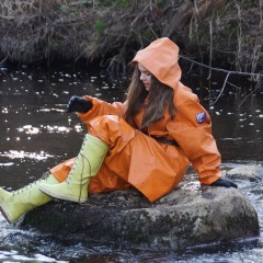 Adventureinwellies: Darina having fun in her wet & muddy orange rainsuit
