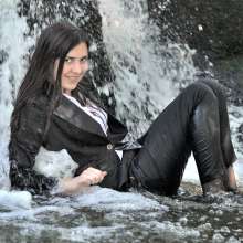 ufa217: Violeta in a business suit at the waterfall.