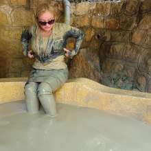 Wet_look_elena: Skirt Jacket and High Boots in Mud