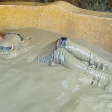 Wet_look_elena: Skirt Jacket and High Boots in Mud