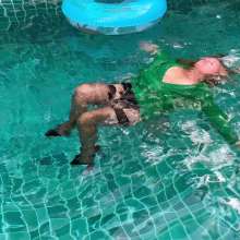 Wet_look_elena: Green Dress and Stockings in the Pool