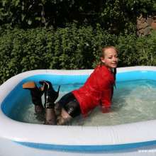 eileenvogel: W382 Eileen in a red black business suit in kiddy pool