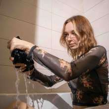Wet Live Team: Mila Got Wet in Shorts and a Fishnet-shirt, Wetlook Girl