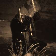 Swamp Angel: 86 Ir Latex Mask and Leather Skirt Mud Bath