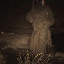 Swamp Angel: 86 Ir Latex Mask and Leather Skirt Mud Bath