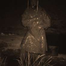 Swamp Angel: 86 Ir Latex Mask and Leather Skirt Mud Bath