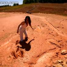 Jayce: White Clothes and Pantyhose Trashed in Thick, Smooth Mud!