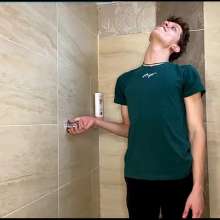 WETColours: Dario in the Shower in Green Shirt and Pants with Shampoo