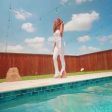 WetlookFashion: Jasmine Gets Wet in a White Jumpsuit and Heels