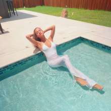 WetlookFashion: Jasmine Gets Wet in a White Jumpsuit and Heels