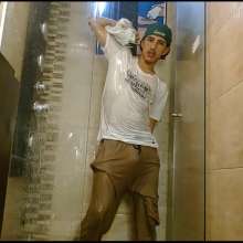 WETColours: Nixon Has Fun in Shower Wearing a White T-shirt with Cap