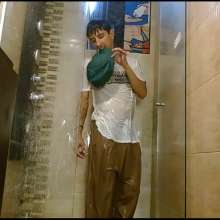 WETColours: Nixon Has Fun in Shower Wearing a White T-shirt with Cap