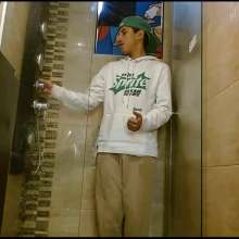 WETColours: Nixon Has Fun in Shower Wearing a White T-shirt with Cap