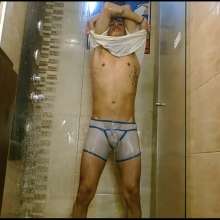WETColours: Nixon Has Fun in Shower Wearing a White T-shirt with Cap