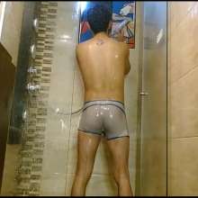 WETColours: Nixon Has Fun in Shower Wearing a White T-shirt with Cap