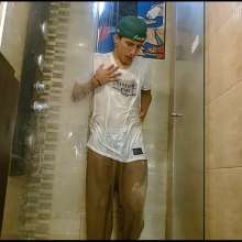 WETColours: Nixon Has Fun in Shower Wearing a White T-shirt with Cap