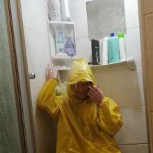 Thefetishgirl: Switch Rainwear in Shower