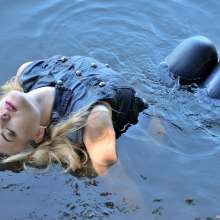 ufa217: Kylie in denim suit swims in the river.