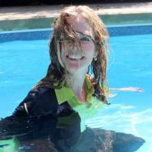 April Showers Wetlook: New Video!  Black Cardigan, Yellow Blouse, Skirt and Boots in Pool
