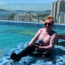 Wet_look_elena: Latex Pants and Big Boots in the Pool