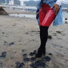 Wet_look_elena: Red Latex Pants in Mud