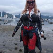 Wet_look_elena: Red Latex Pants in Mud