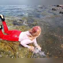 Wet_look_elena: Red Latex Pants in the Sea