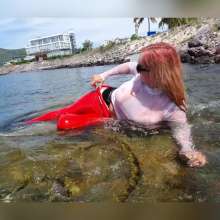 Wet_look_elena: Red Latex Pants in the Sea