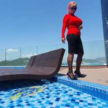 Wet_look_elena: Red Top Back Skirt Stockings and Heels in the Pool