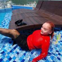 Wet_look_elena: Red Top Back Skirt Stockings and Heels in the Pool