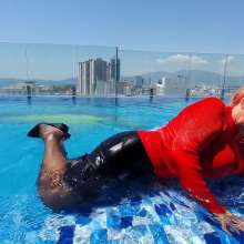 Wet_look_elena: Red Top Back Skirt Stockings and Heels in the Pool