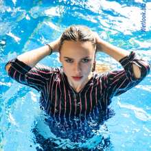 wet.look.me: Wetlook girl dressed in a striped jumper and pants suit | Wetlook.biz