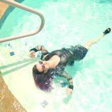 WetlookFashion: Petra Gets Wet in Latex and Leather