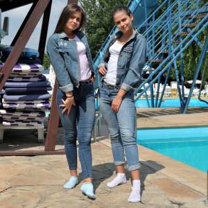 ufa217: Twins in denim suits swim in the pool.